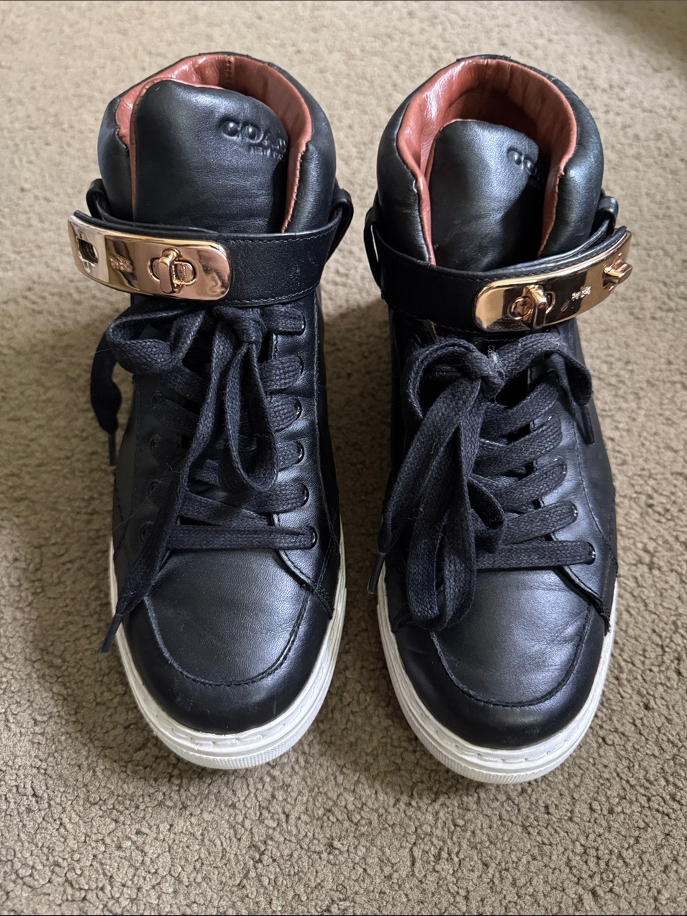 Black High-Top Sneakers with Gold Hardware